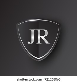 Initial logo letter JR with shield Icon silver color isolated on black background, logotype design for company identity.