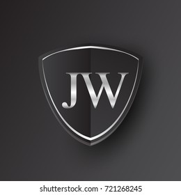 Initial logo letter JW with shield Icon silver color isolated on black background, logotype design for company identity.