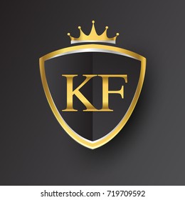 Initial logo letter KF with shield and crown Icon golden color isolated on black background.