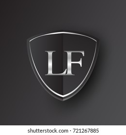 Initial logo letter LF with shield Icon silver color isolated on black background, logotype design for company identity.