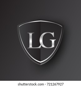 Initial logo letter LG with shield Icon silver color isolated on black background, logotype design for company identity.