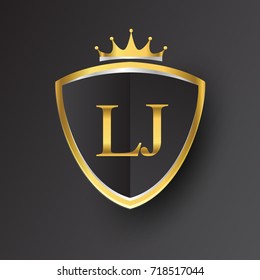 Initial logo letter LJ with shield and crown Icon golden color isolated on black background, logotype design for company identity.