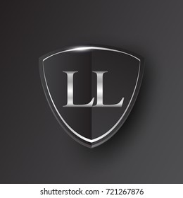 Initial logo letter LL with shield Icon silver color isolated on black background, logotype design for company identity.