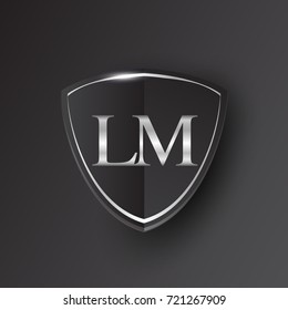 Initial logo letter LM with shield Icon silver color isolated on black background, logotype design for company identity.