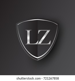 Initial logo letter LZ with shield Icon silver color isolated on black background, logotype design for company identity.