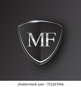 Initial logo letter MF with shield Icon silver color isolated on black background, logotype design for company identity.