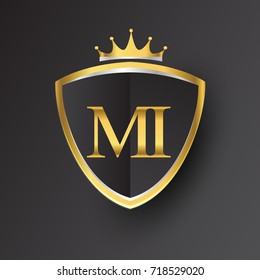 Initial logo letter MI with shield and crown Icon golden color isolated on black background, logotype design for company identity.