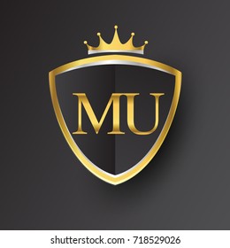 Initial logo letter MU with shield and crown Icon golden color isolated on black background, logotype design for company identity.