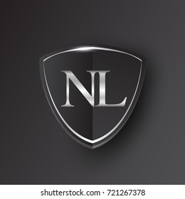 Initial logo letter NL with shield Icon silver color isolated on black background, logotype design for company identity.