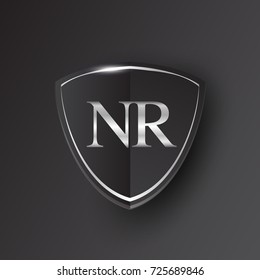 Initial logo letter NR with shield Icon silver color isolated on black background, logotype design for company identity.