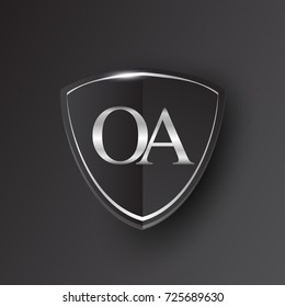 Initial logo letter OA with shield Icon silver color isolated on black background, logotype design for company identity.