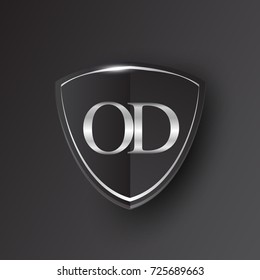 Initial logo letter OD with shield Icon silver color isolated on black background, logotype design for company identity.