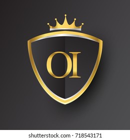 Initial logo letter OI with shield and crown Icon golden color isolated on black background, logotype design for company identity.