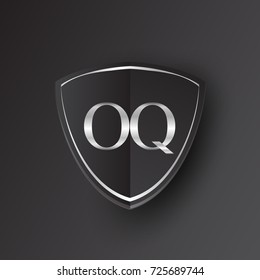 Initial logo letter OQ with shield Icon silver color isolated on black background, logotype design for company identity.