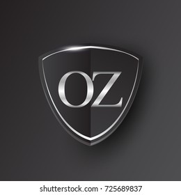 Initial logo letter OZ with shield Icon silver color isolated on black background, logotype design for company identity.
