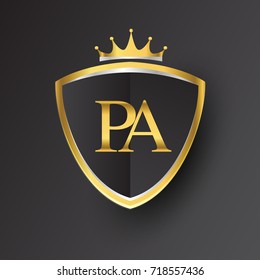 Initial logo letter PA with shield and crown Icon golden color isolated on black background, logotype design for company identity.