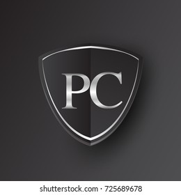 Initial logo letter PC with shield Icon silver color isolated on black background, logotype design for company identity.