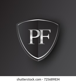 Initial logo letter PF with shield Icon silver color isolated on black background, logotype design for company identity.