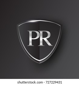 Initial logo letter PR with shield Icon silver color isolated on black background, logotype design for company identity.