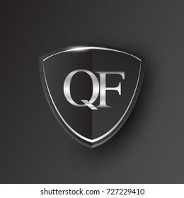 Initial logo letter QF with shield Icon silver color isolated on black background, logotype design for company identity.