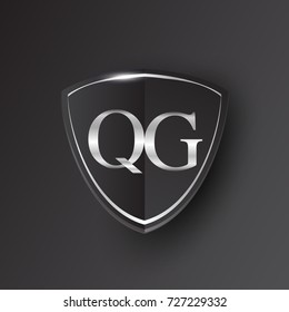 Initial logo letter QG with shield Icon silver color isolated on black background, logotype design for company identity.