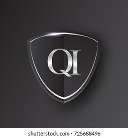 Initial logo letter QI with shield Icon silver color isolated on black background, logotype design for company identity.