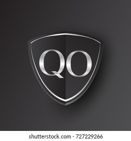 Initial logo letter QO with shield Icon silver color isolated on black background, logotype design for company identity.