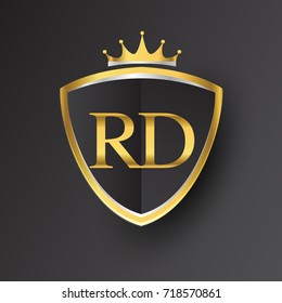 Initial logo letter RD with shield and crown Icon golden color isolated on black background, logotype design for company identity.