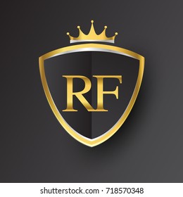 Initial logo letter RF with shield and crown Icon golden color isolated on black background, logotype design for company identity.