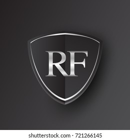 Initial logo letter RF with shield Icon silver color isolated on black background, logotype design for company identity.