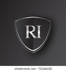 Initial logo letter RI with shield Icon silver color isolated on black background, logotype design for company identity.