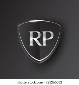 Initial logo letter RP with shield Icon silver color isolated on black background, logotype design for company identity.