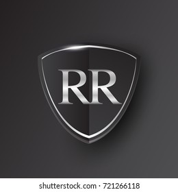 Initial logo letter RR with shield Icon silver color isolated on black background, logotype design for company identity.