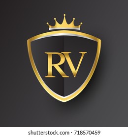 Initial logo letter RV with shield and crown Icon golden color isolated on black background, logotype design for company identity.