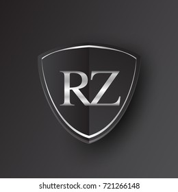 Initial logo letter RZ with shield Icon silver color isolated on black background, logotype design for company identity.