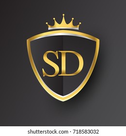 Initial logo letter SD with shield and crown Icon golden color isolated on black background, logotype design for company identity.