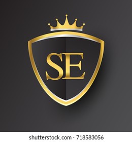 Initial logo letter SE with shield and crown Icon golden color isolated on black background, logotype design for company identity.