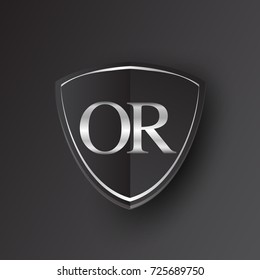Initial logo letter OR with shield Icon silver color isolated on black background, logotype design for company identity.