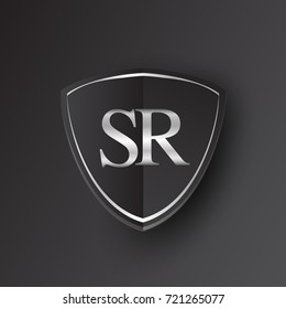 Initial logo letter SR with shield Icon silver color isolated on black background, logotype design for company identity.