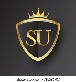 Initial logo letter SU with shield and crown Icon golden color isolated on black background, logotype design for company identity.