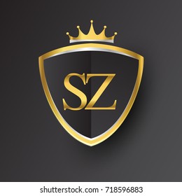 Initial logo letter SZ with shield and crown Icon golden color isolated on black background, logotype design for company identity.