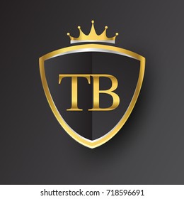 Initial logo letter TB with shield and crown Icon golden color isolated on black background, logotype design for company identity.