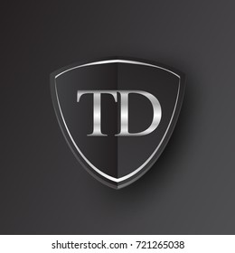 Initial logo letter TD with shield Icon silver color isolated on black background, logotype design for company identity.