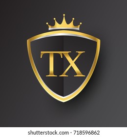 Initial logo letter TX with shield and crown Icon golden color isolated on black background, logotype design for company identity.