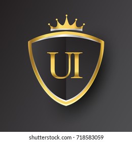 Initial logo letter UI with shield and crown Icon golden color isolated on black background, logotype design for company identity.