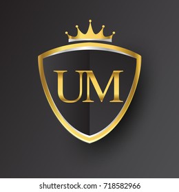 Initial logo letter UM with shield and crown Icon golden color isolated on black background, logotype design for company identity.