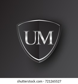 Initial logo letter UM with shield Icon silver color isolated on black background, logotype design for company identity.