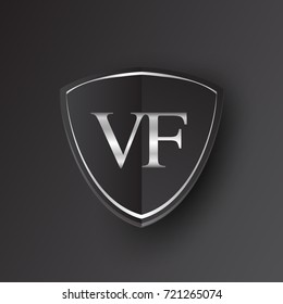 Initial logo letter VF with shield Icon silver color isolated on black background, logotype design for company identity.