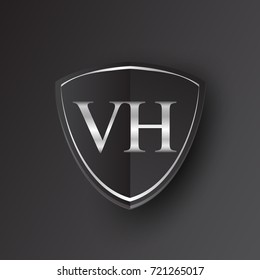 Initial logo letter VH with shield Icon silver color isolated on black background, logotype design for company identity.