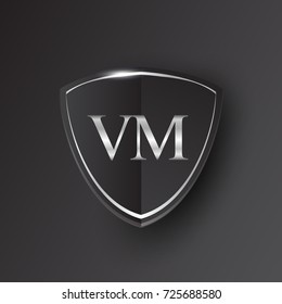 Initial logo letter VM with shield Icon silver color isolated on black background, logotype design for company identity.